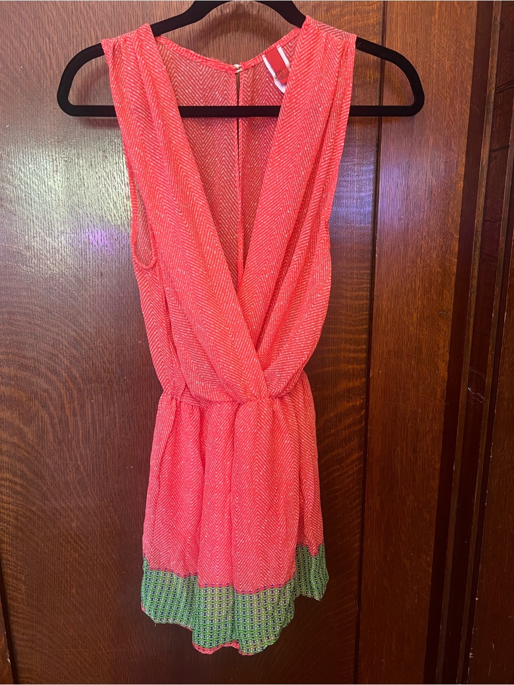 CAbi Coral Sleeveless Wrap Romper with Green-Trim Accent